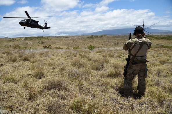 An Air Force combat controller from the 320th Special Tactics Squadron uses a satellite communication antenna to coordinate with the operations center during a humanitarian assistance and disaster response scenario as part of Rim of the Pacific(RIMPAC) 2016, Pohakuloa Training Area, Hawaii, July 10, 2016. Twenty-six nations, more than 40 ships and submarines, more than 200 aircraft and 25,000 personnel are participating in RIMPAC from June 30 to Aug. 4. RIMPAC provides a unique training opportunity that helps participants foster and sustain the cooperative relationships that are critical to ensuring the safety of sea lanes and security on the world's oceans. (U.S. Air Force photo by 2nd Lt. Jaclyn Pienkowski/Released)