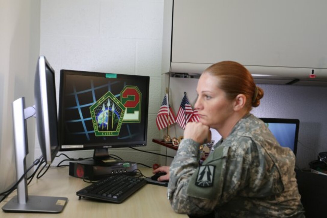 Staff Sgt. Lydia M. Seaborn, 335th Signal Command (Theater) Cyber Brigade, Army Reserve Cyber Operations Group, National Capital Region Cyber Protection Center, demonstrates cyber operations capabilities. (Photo Credit: Mike Milord)