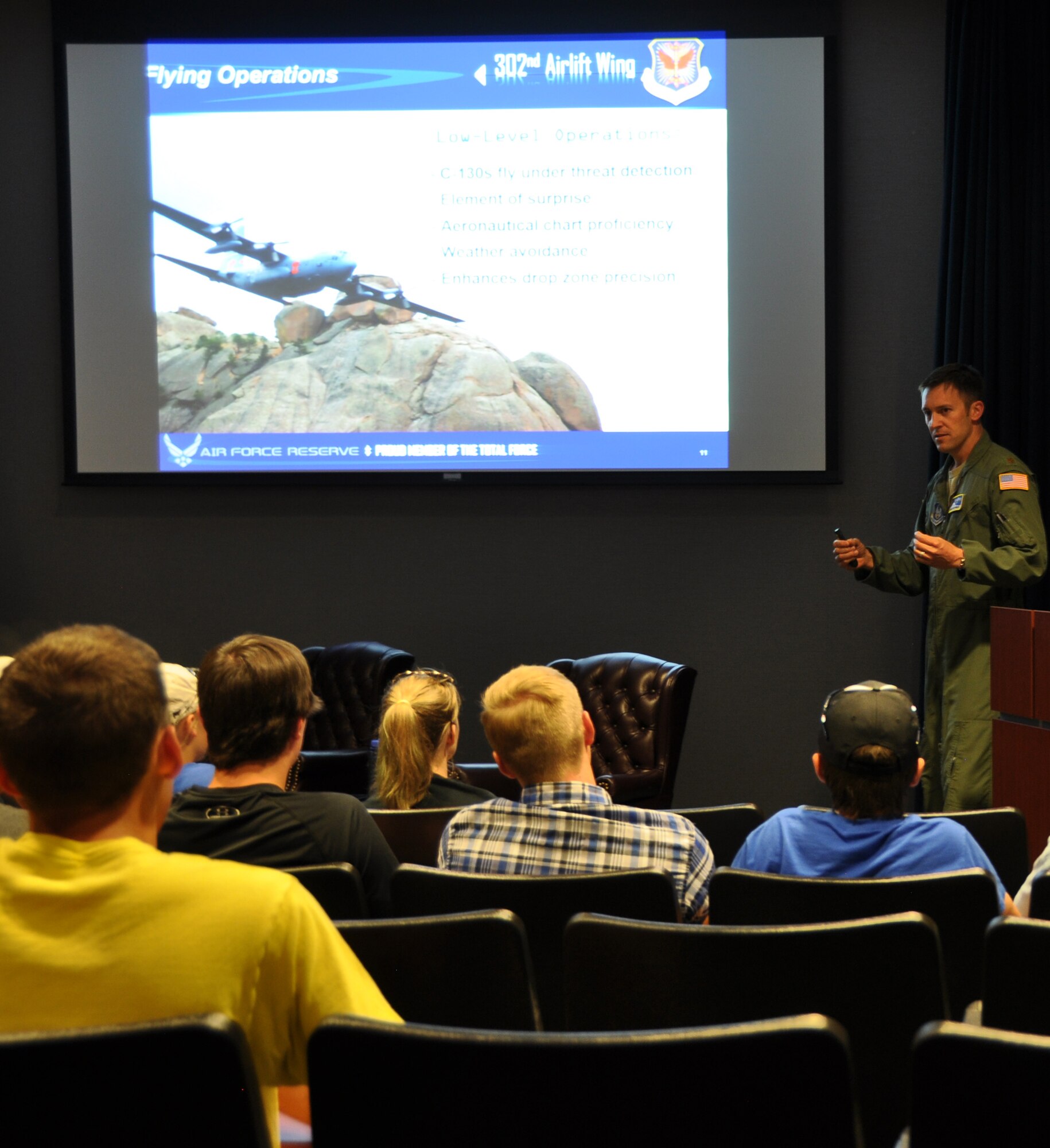 PETERSON AIR FORCE BASE, Colo. --  Maj. Brian McReynolds, a Modular Airborne Fire Fighting System certified C-130 pilot, gives the wing mission briefing to students from the Aviation Education Foundation of Colorado, Inc. during their visit to the Air Force Reserve Command’s 302nd Airlift Wing, June 21, 2016 here. Following the briefing, the 25 students toured a static C-130 aircraft. According to their website, “the mission of the AEFCO, Inc. is to provide aviation education programs for local young people that promote an awareness of careers in professional aviation and aerospace fields.” (U.S. Air Force photo/Daniel Butterfield) 