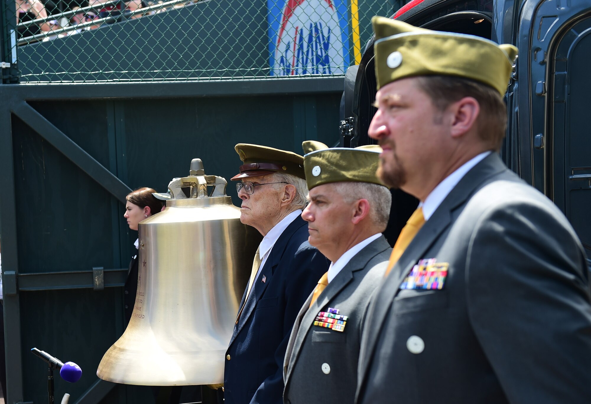 Veterans take part in a military appreciation ceremony July 10, 2016, during the pre-game activities of a Colorado Rockies game at Coors Field in Denver. The veterans had the privilege of ringing the Honor Bell, which is dedicated to those who have served and sacrificed. (U.S. Air Force photo by Airman 1st Class Gabrielle Spradling/Released)