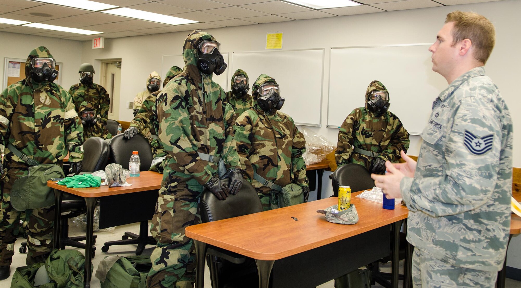 Tech Sgt. Nicholas Schneider, 920th Rescue Wing emergency manager, holds a refresher course for 920th RQW Reservists during July’s Unit Training Assembly on CBRN – chemical, biological, radiological and nuclear warfare defense here. CBRN training is part of the Wing’s combat readiness to ensure Reservists are up-to-date on this life saving measure of how to protect themselves in case of emergency.(U.S. Air Force photo/Capt. Leslie Forshaw)