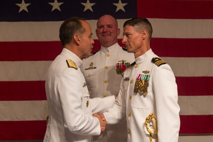 Cmdr. Jeffery Lock relieved Capt. John Robinson as Commanding Officer, Surface Combat Systems Center (SCSC).  (l-r) Rear Admiral Jon Hill, Program Executive Officer for Integrated Warfare Systems, Captain John P. Robinson, SCSC’s departing Commanding Officer, Commander Jeffery Lock, SCSC Commanding Officer.