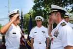 Capt. James C. Beene (left) relieves Capt. Todd M. Siddall (right) as commanding officer of Naval Ordnance Safety and Security Activity (NOSSA) as RDML Thomas Kearney looks on during a change of command ceremony at Naval Support Facility Indian Head, Md., July 8.
