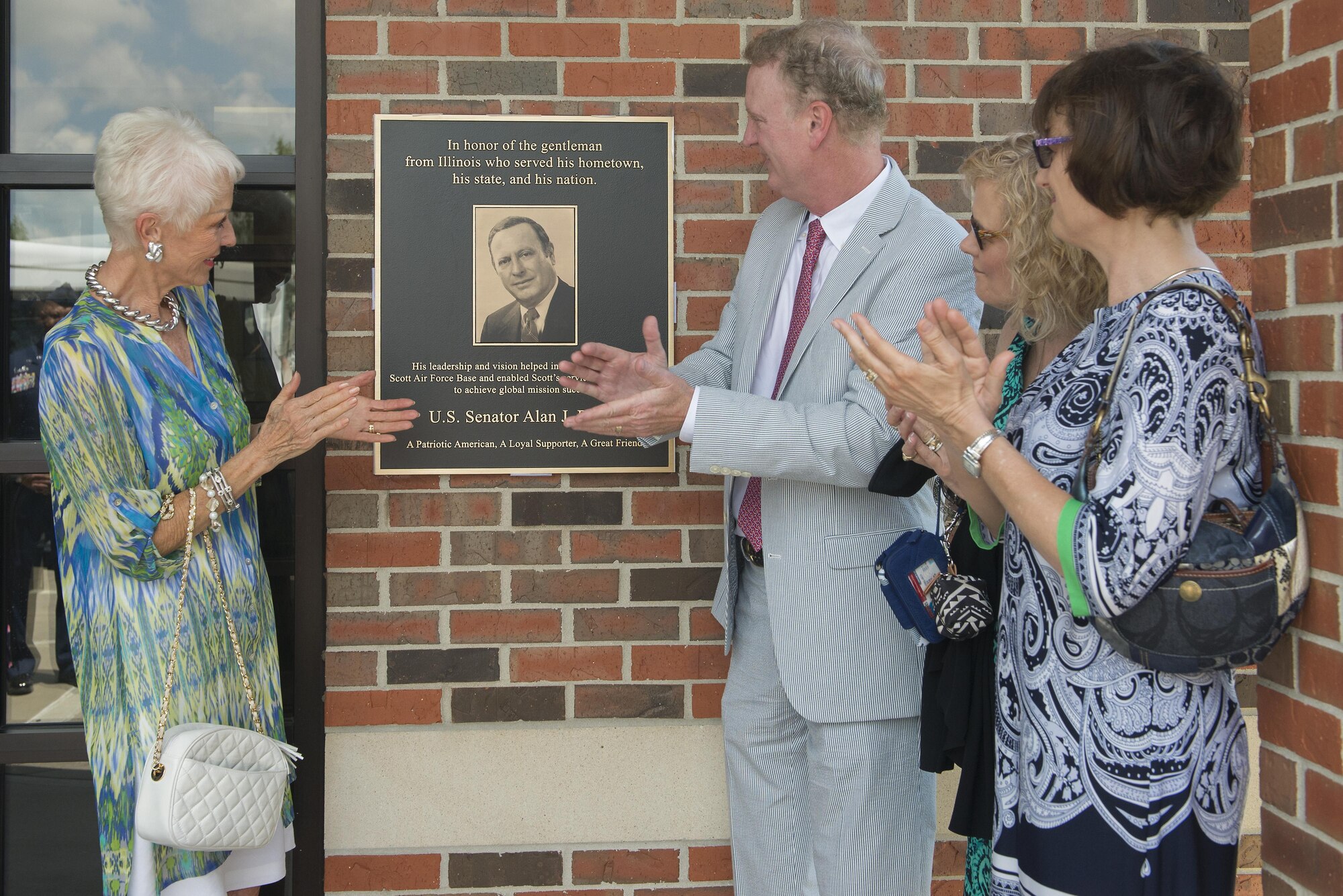 Ill. Sen. Alan J. Dixon’s wife, Jody Dixon, and son, Jeff Dixon, unveil a plaque during a dedication ceremony at the visitors control center at Scott Air Force Base, Ill., July 8, 2016. The visitor control center was dedicated to Dixon, who gave 43 years of public service to Scott AFB and the state of Ill.

(U.S. Air Force photo/ Senior Airman Kiana Brothers)
