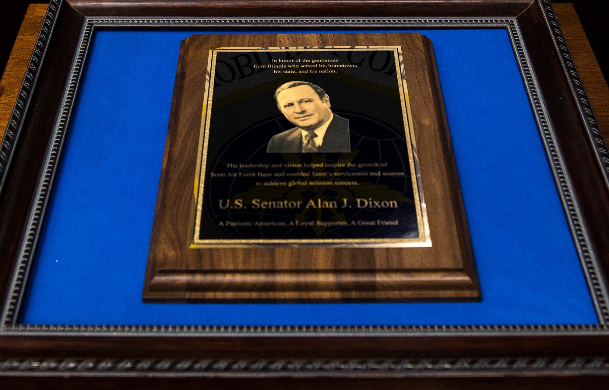 Former Ill. Sen. Alan J. Dixon is imprinted on a plaque that is to be presented to his family during his dedication ceremony at Scott Air Force Base, Ill., July 8, 2016.  The visitor center was dedicated to Dixon, who gave 43 years of public service to Scott AFB and the state of Ill. (U.S. Air Force photo by Jodi Martinez/Released)