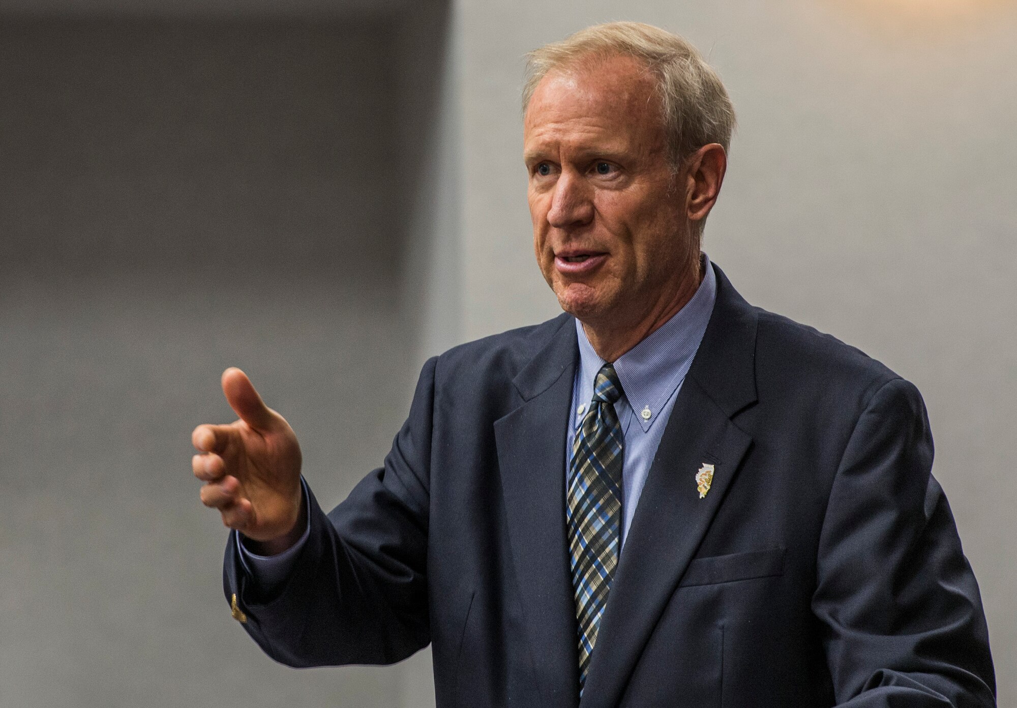 Ill. Gov. Bruce Rauner speaks during a dedication for former Ill. Sen. Alan J. Dixon, who passed away in 2014, at Scott Air Force Base, Ill., July 8, 2016.  The visitor control center was dedicated to Dixon, who gave 43 years of public service to Scott AFB and the state of Ill. (U.S. Air Force photo by Jodi Martinez/Released)