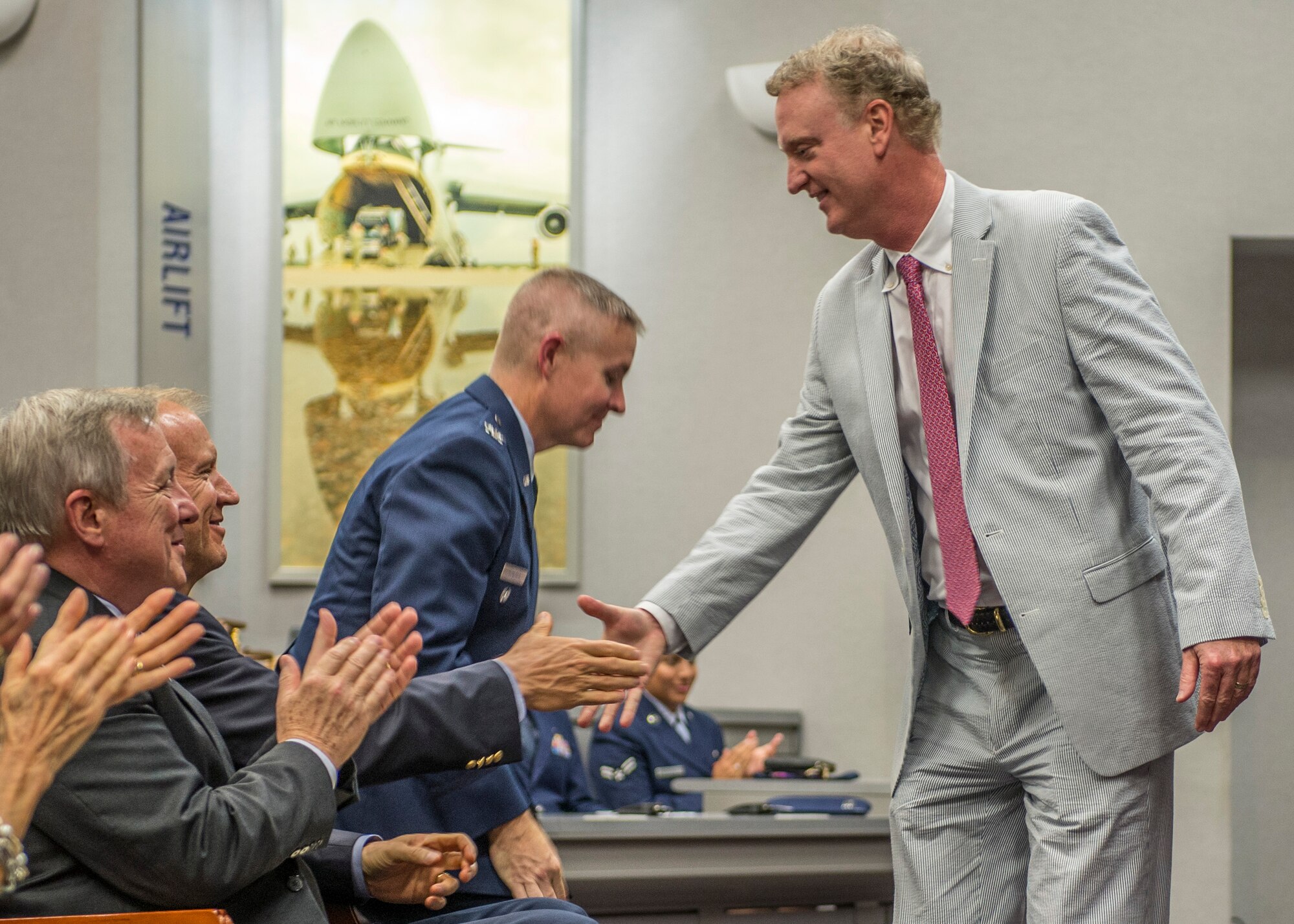 Sen. Alan J. Dixon's son, Jeff, shakes the hand of Sen. Dick Durbin during a dedication ceremony honoring his father on Scott Air Force Base, Ill., July 8, 2016.  The visitor center was dedicated to Dixon, who gave 43 years of public service to Scott AFB and the state of Ill. (U.S. Air Force photo by Jodi Martinez/Released)