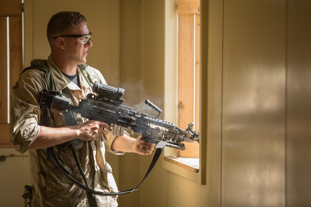 U.S. Army Pvt. Chad Turlington, 222nd Battalion, 1st Brigade Combat Team, 10th Mountain Division, engages a M113 Armored Personnel Carrier with a M249 Squad Automatic Weapon equipped with a Multiple Integrated Laser Engagement System during Warrior Exercise (WAREX) 86-16-03 at Fort McCoy, Wis., July 12, 2016. WAREX is an exercise designed to keep soldiers all across the United States ready to deploy. (U.S. Army photo by Sgt. Robert Farrell/Released).