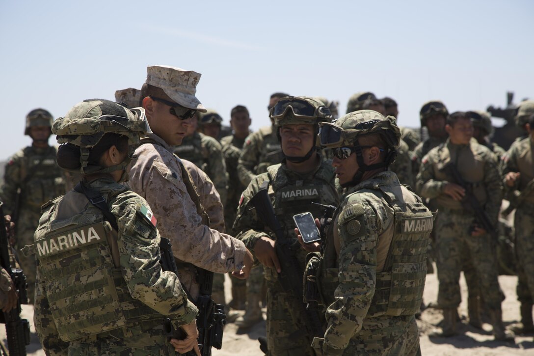 A U.S. Marine and Mexican Sailors during RIMPAC 2016 discusses the course of action during amphibious assault operations training for Rim of the Pacific 2016 aboard Camp Pendleton, Calif., July 9, 2016. Twenty-six nations, more than 40 ships and submarines, more than 200 aircraft and 25,000 personnel are participating in RIMPAC from June 30 to Aug. 4, in and around the Hawaiian Islands and Southern California. The world's largest international maritime exercise, RIMPAC provides a unique training opportunity that helps participants foster and sustain the cooperative relationships that are critical to ensuring the safety of sea lanes and security on the world's oceans. RIMPAC 2016 is the 25th exercise in the series that began in 1971.