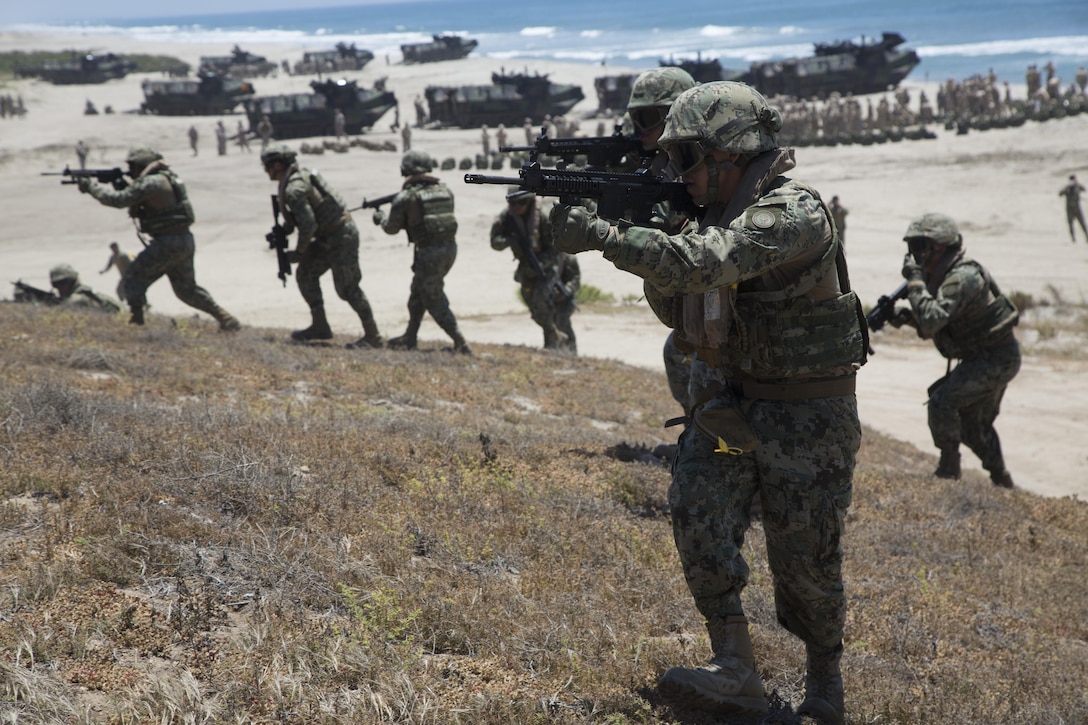 Mexican sailors storm the shores of Red Beach after landing with U.S. Marines from 3rd Amphibious Assault Battalion during Rim of the Pacific 2016, aboard Camp Pendleton, Calif., July 9, 2016. Twenty-six nations, more than 40 ships and submarines, more than 200 aircraft and 25,000 personnel are participating in RIMPAC from June 30 to Aug. 4, in and around the Hawaiian Islands and Southern California. The world's largest international maritime exercise, RIMPAC provides a unique training opportunity that helps participants foster and sustain the cooperative relationships that are critical to ensuring the safety of sea lanes and security on the world's oceans. RIMPAC 2016 is the 25th exercise in the series that began in 1971