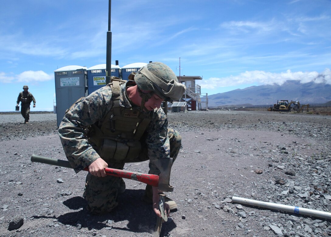 Cpl. Andrew White, a motor transportation operator, hammers a stake into the ground that will support a large antenna on Range 1, near the Pohakuloa Training Area, Hawaii, July 8, 2016. The antenna will be used to broaden Marines' area of communication during Rim of the Pacific 2016. Twenty-six nations, 49 ships, six submarines, about 200 aircraft, and 25,000 personnel are participating in Rim of the Pacific 2016 from June 29 to Aug. 4 in and around the Hawaiian Islands and Southern California. The world’s largest international maritime exercise, RIMPAC provides a unique training opportunity while fostering and sustaining cooperative relationships between participants critical to ensuring the safety of sea lanes and security on the world’s oceans. RIMPAC 16 is the 25th exercise in the series that began in 1971. White, a native of Memphis, Tennessee, is with 3rd Marine Regiment, 3rd Marine Division, III Marine Expeditionary Force. 