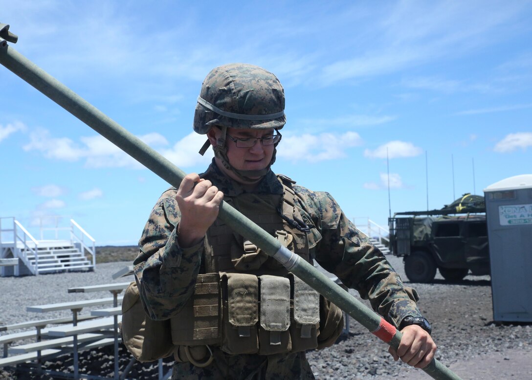 Lance Cpl. Thomas Gardner assembles an antenna on Range 1, near the Pohakuloa Training Area, Hawaii, July 8, 2016. The antenna will be used to broaden Marines' area of communication during Rim of the Pacific 2016. Twenty-six nations, 49 ships, six submarines, about 200 aircraft, and 25,000 personnel are participating in Rim of the Pacific 2016 from June 29 to Aug. 4 in and around the Hawaiian Islands and Southern California. The world’s largest international maritime exercise, RIMPAC provides a unique training opportunity while fostering and sustaining cooperative relationships between participants critical to ensuring the safety of sea lanes and security on the world’s oceans. RIMPAC 16 is the 25th exercise in the series that began in 1971. Gardner, a native of Rock Springs, Wyoming, is a field radio operator with 3rd Marine Regiment, 3rd Marine Division, III Marine Expeditionary Force.