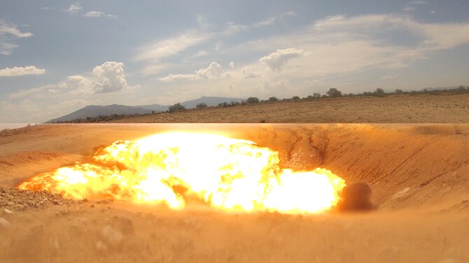 A charge is detonated during an explosive ordnance disposal orientation at Davis-Monthan Air Force Base, Ariz., June 28, 2016. This immersion serves a dual purpose: showing Airmen exactly what EOD technicians do on a regular basis and determining if a candidate is right for the job. (U.S. Air Force photo/Senior Airman Samuel O’Brien)