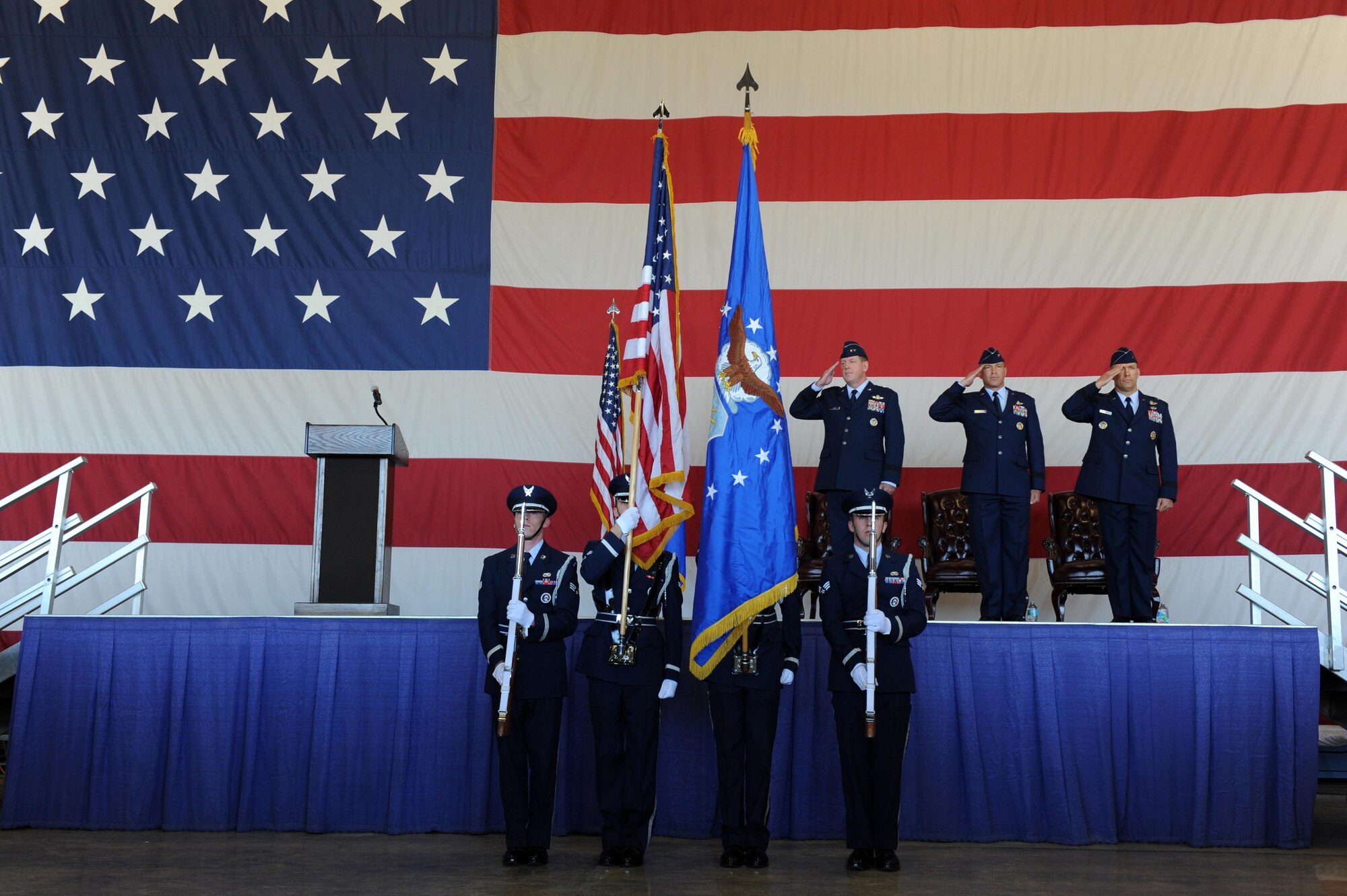 The Luke Air Force Base honor guardsmen present the colors during the 56th Fighter Wing change of command July 13, 2016 at Luke Air Force Base, Arizona. The change of command ceremony is a military tradition, deeply rooted in history dating back to the time of Frederick the Great of Prussia. (U.S. Air Force photo by Airman 1st Class Pedro Mota)