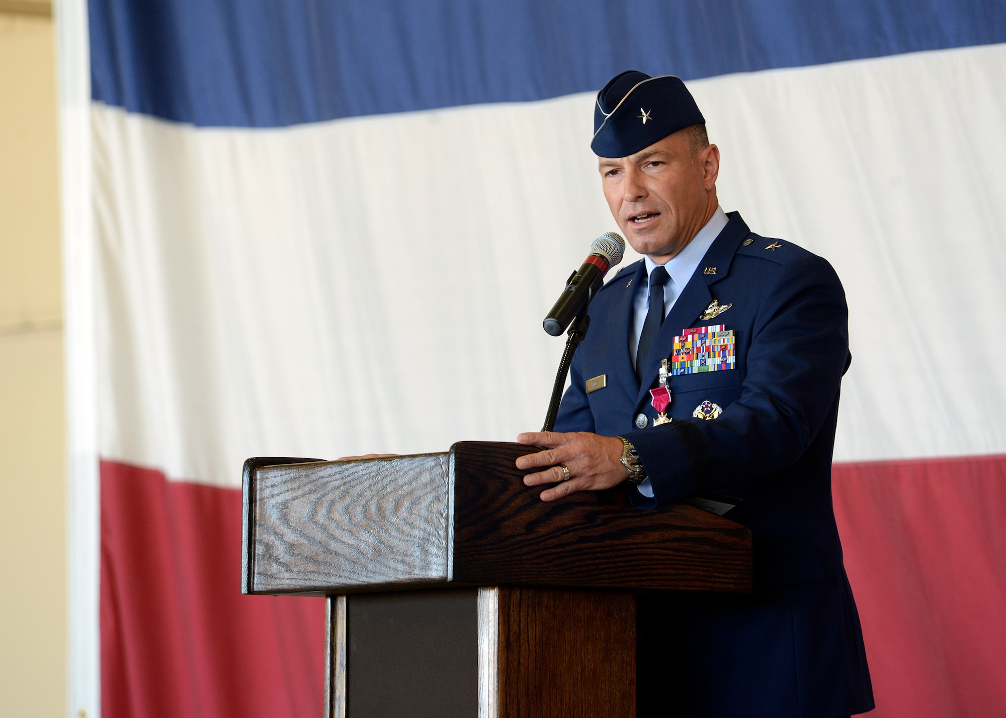 Brig. Gen. Scott Pleus, outgoing 56th Fighter Wing commander, addresses the fighter wing for the last time as their commander during the 56th Fighter Wing Change of Command ceremony July 13, 2016 at Luke Air Force Base, Ariz.  (U.S. Air Force photo by Senior Airman Devante Williams)