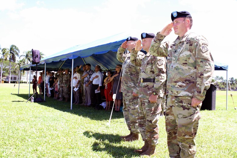 Honolulu District Commander Lt. Col. James D. Hoyman (right), former Pacific Ocean Division Commander Brig. Gen. Jeffrey L. Milhorn and outgoing District Commander Lt. Col. Christopher W. Crary, salute during the presentation of the colors at the Honolulu District Change of Command ceremony July 11 on Palm Circle at Fort Shafter. At the ceremony Hoyman became the 70th Commander of the U.S. Army Corps of Engineers Honolulu District. 
