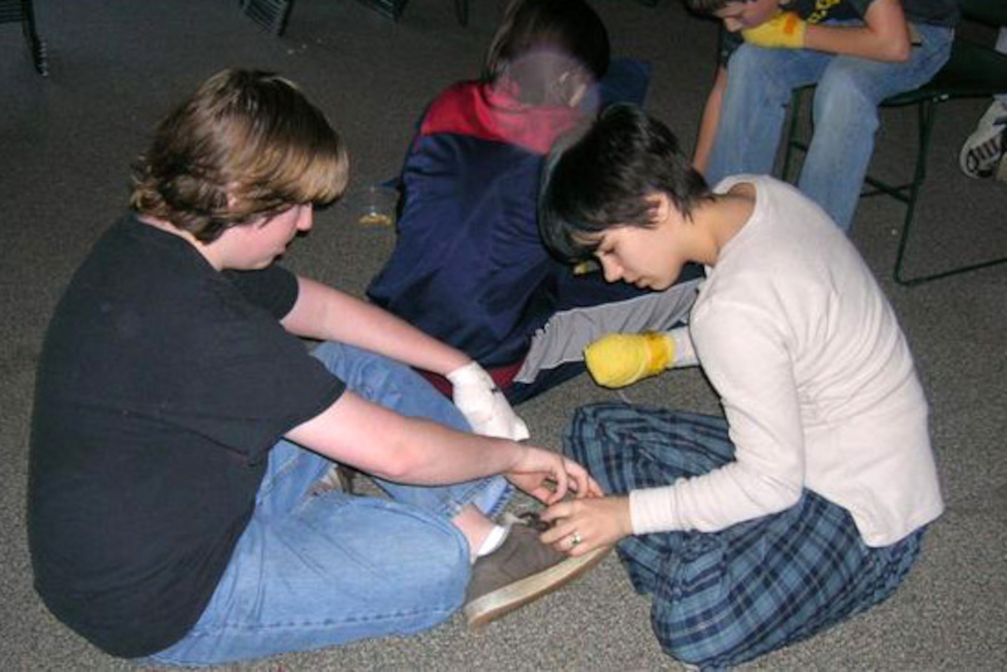 Airman 1st Class Sarah Atamian, 460th Medical Group flight medicine medical technician, takes part in a wounded veteran’s fundraiser at the First Universalist Society of Franklin in Franklin, Mass., during her freshman year in high school. Atamian, along with others in her church, bandaged either their foot or hand for 24 hours to try and understand what living like an amputee would be like. (Courtesy photo)