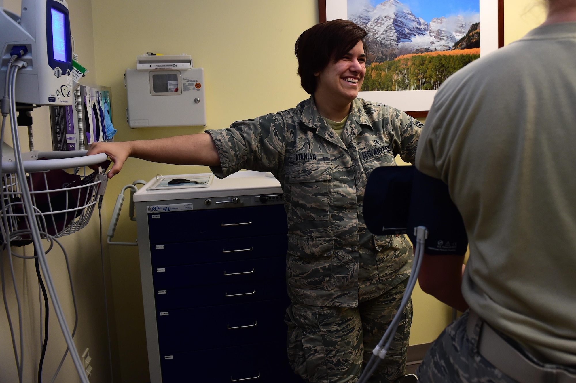 Airman 1st Class Sarah Atamian, 460th Medical Group flight medicine medical technician, checks the blood pressure of a patient June 30, 2016, on Buckley Air Force Base, Colo. Atamian hopes to use the skills she learns as a medical technician to help others one day as a chaplain. (U.S. Air Force photo by Airman 1st Class Gabrielle Spradling/Released)