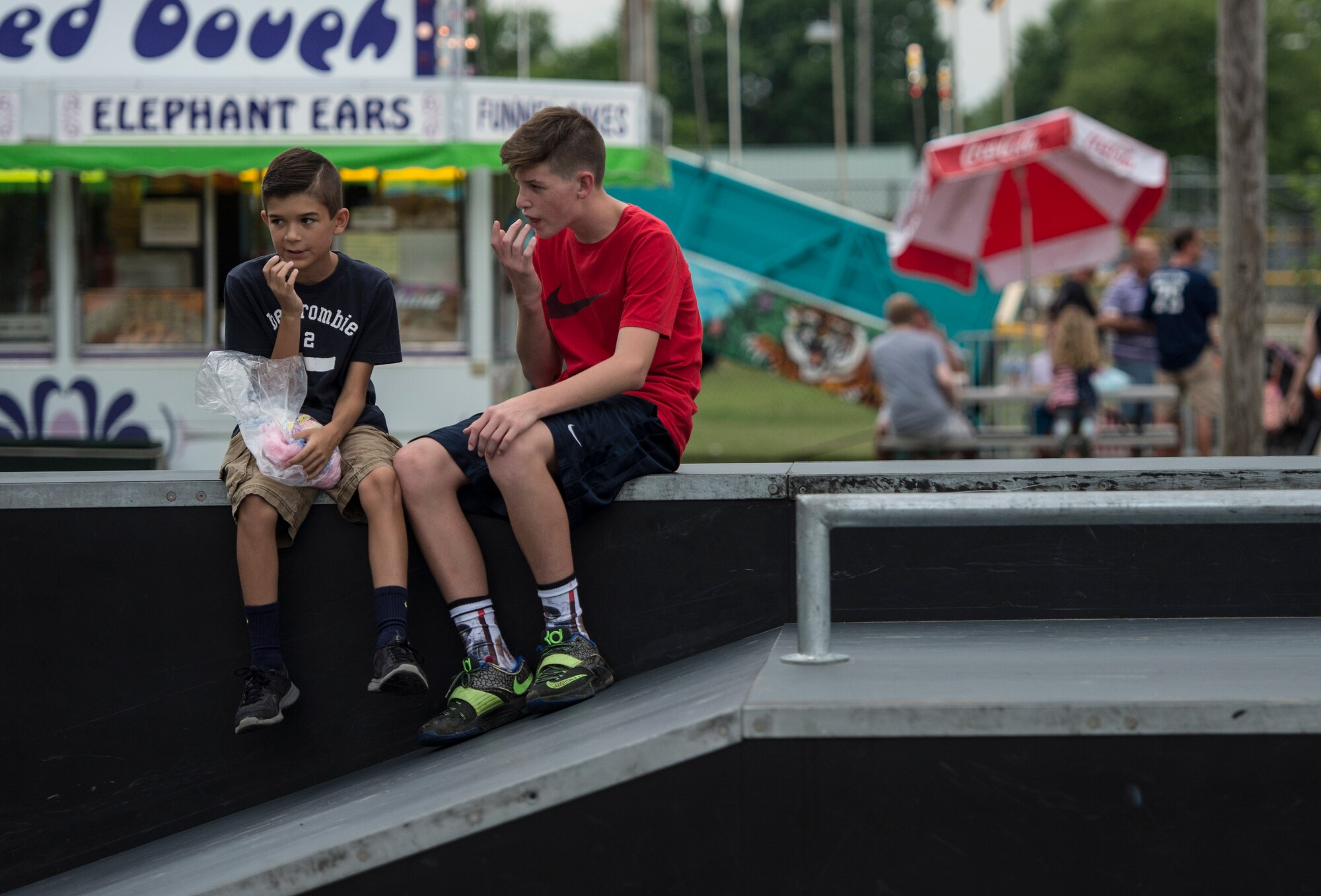 Despite the rainy weekend, thousands made it to the Old Fashioned 4th of July Celebration at Scheve Park, which featured carnival rides, live bands, food and craft booths, softball and kickball tournaments, games, raffles, poker and a fireworks show, Mascoutah, Ill., July 4, 2016.  Col. Terrence Adams, 375th Communications Group commander, spoke to spectators during the event in remembrance of Independence Day.  Following Adams, the U.S. Air Force Band of Mid-America’s Roots in Blue played favorite classics and current hits until fireworks lit the night sky. (U.S. Air Force photo by Staff Sgt. Jodi Martinez/Released)