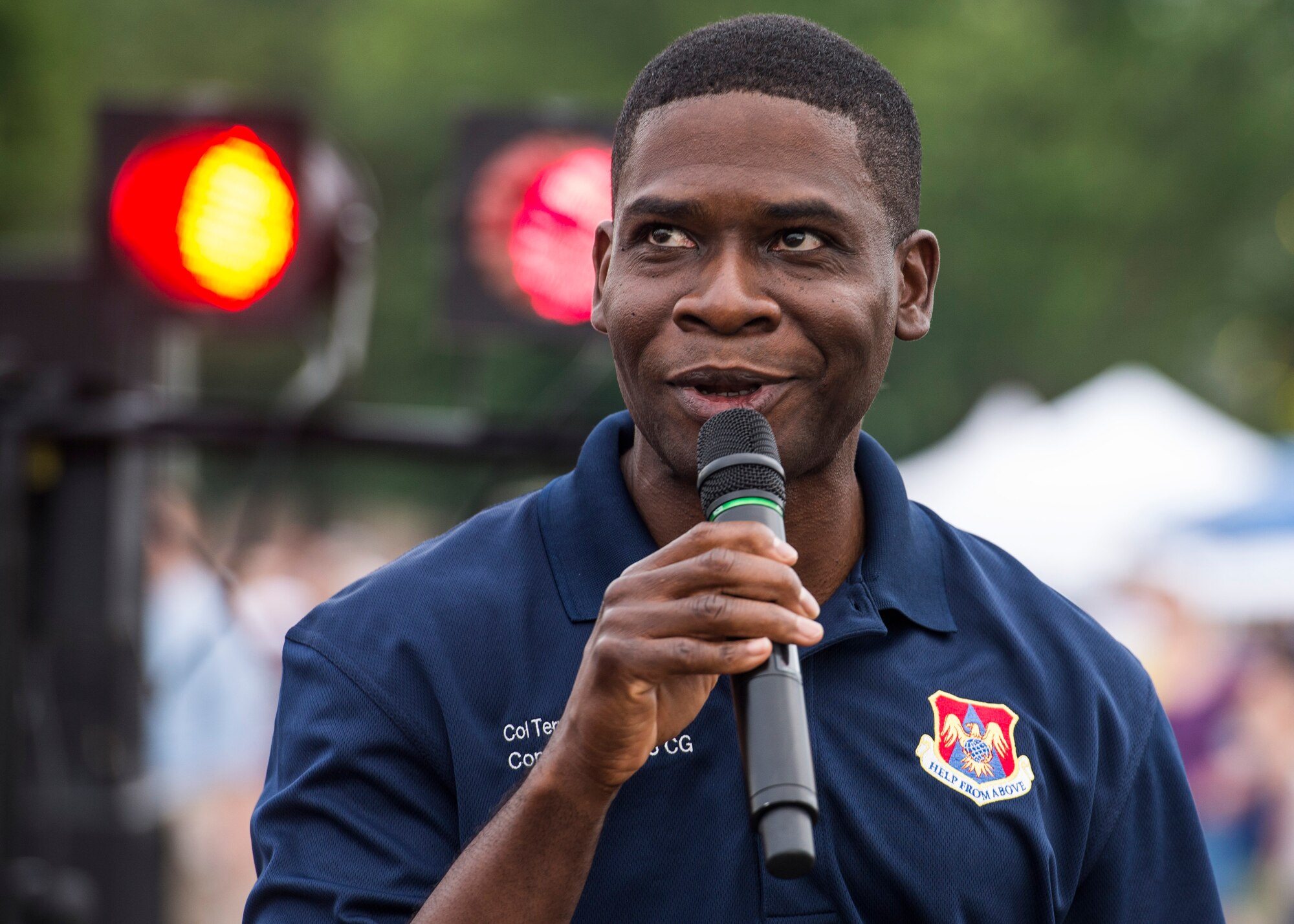 Despite the rainy weekend, thousands made it to the Old Fashioned 4th of July Celebration at Scheve Park, which featured carnival rides, live bands, food and craft booths, softball and kickball tournaments, games, raffles, poker and a fireworks show, Mascoutah, Ill., July 4, 2016.  Col. Terrence Adams, 375th Communications Group commander, spoke to spectators during the event in remembrance of Independence Day.  Following Adams, the U.S. Air Force Band of Mid-America’s Roots in Blue played favorite classics and current hits until fireworks lit the night sky. (U.S. Air Force photo by Staff Sgt. Jodi Martinez/Released)