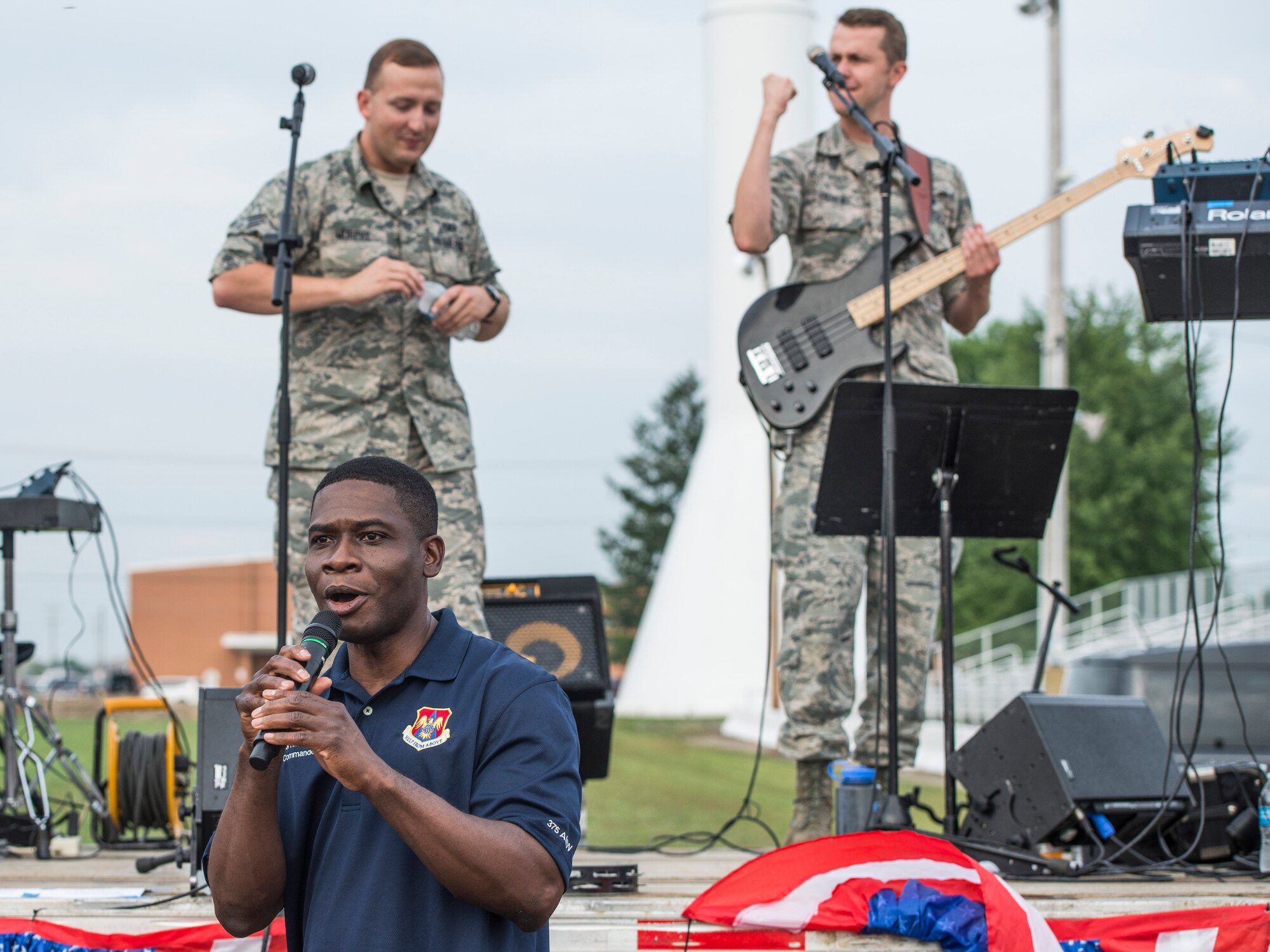 Despite the rainy weekend, thousands made it to the Old Fashioned 4th of July Celebration at Scheve Park, which featured carnival rides, live bands, food and craft booths, softball and kickball tournaments, games, raffles, poker and a fireworks show, Mascoutah, Ill., July 4, 2016.  Col. Terrence Adams, 375th Communications Group commander, spoke to spectators during the event in remembrance of Independence Day.  Following Adams, the U.S. Air Force Band of Mid-America’s Roots in Blue played favorite classics and current hits until fireworks lit the night sky. (U.S. Air Force photo by Staff Sgt. Jodi Martinez/Released)