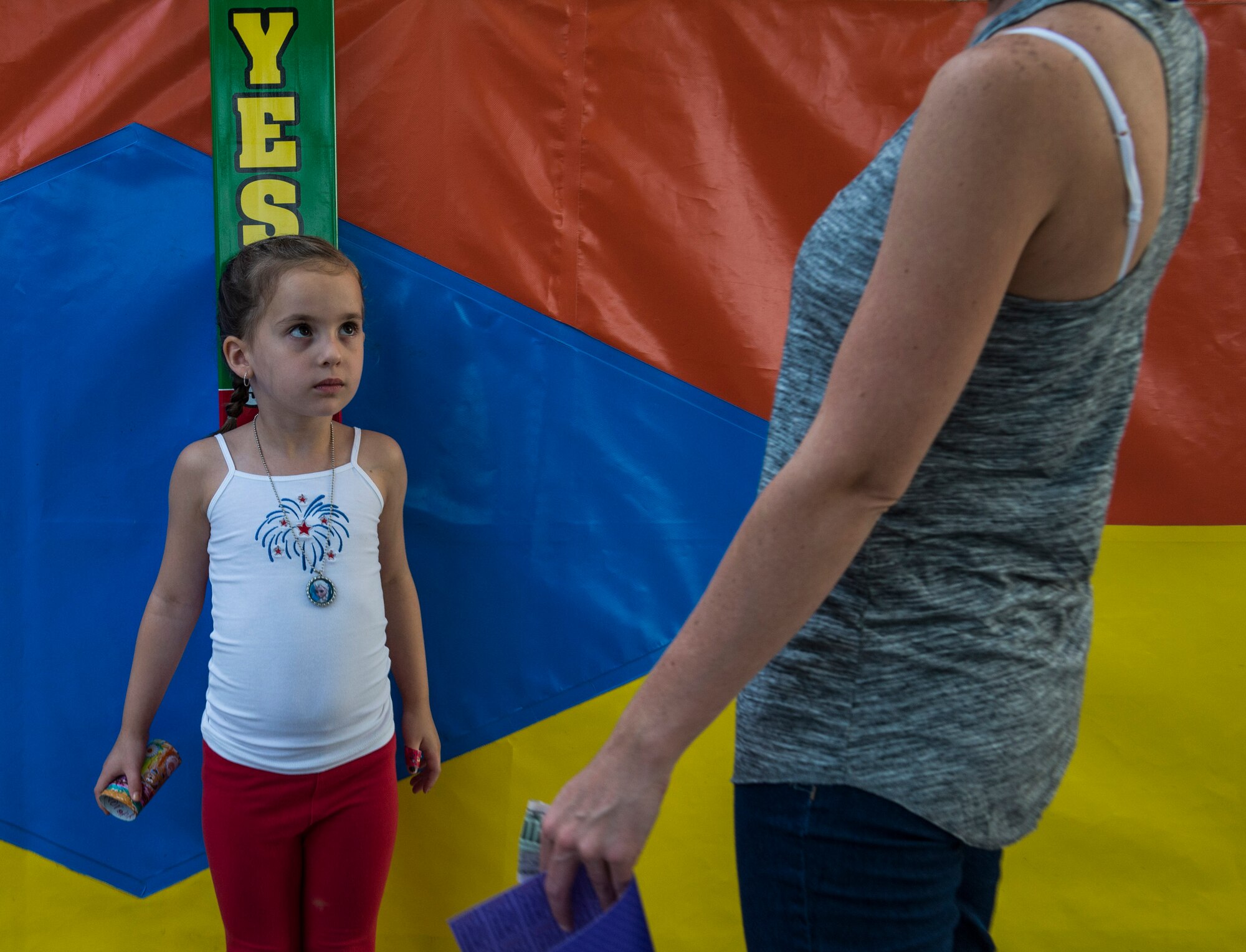 Despite the rainy weekend, thousands made it to the Old Fashioned 4th of July Celebration at Scheve Park, which featured carnival rides, live bands, food and craft booths, softball and kickball tournaments, games, raffles, poker and a fireworks show, Mascoutah, Ill., July 4, 2016.  Col. Terrence Adams, 375th Communications Group commander, spoke to spectators during the event in remembrance of Independence Day.  Following Adams, the U.S. Air Force Band of Mid-America’s Roots in Blue played favorite classics and current hits until fireworks lit the night sky. (U.S. Air Force photo by Staff Sgt. Jodi Martinez/Released)