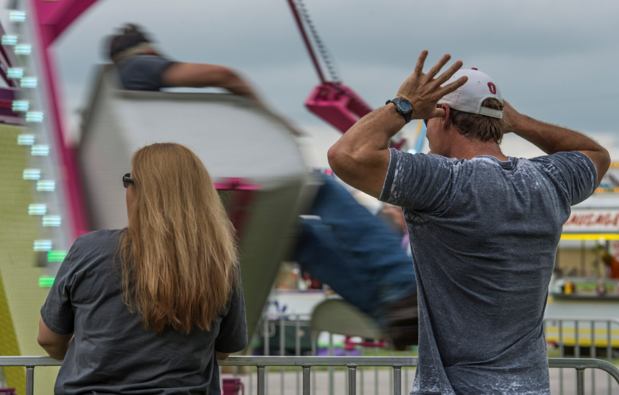 Despite the rainy weekend, thousands made it to the Old Fashioned 4th of July Celebration at Scheve Park, which featured carnival rides, live bands, food and craft booths, softball and kickball tournaments, games, raffles, poker and a fireworks show, Mascoutah, Ill., July 4, 2016.  Col. Terrence Adams, 375th Communications Group commander, spoke to spectators during the event in remembrance of Independence Day.  Following Adams, the U.S. Air Force Band of Mid-America’s Roots in Blue played favorite classics and current hits until fireworks lit the night sky. (U.S. Air Force photo by Staff Sgt. Jodi Martinez/Released)