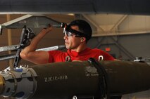 Senior Airman Abdiel Ruiz-Borres, 96th Aircraft Maintenance Unit Crew Cobra 1 member, secures a GBU-38 for transport during the second quarter weapons load competition at Barksdale Air Force Base, La., July 8, 2016. A GBU-38 is a 500-lb guided air-to-surface weapon with a range up to 15 miles and is accurate in any weather condition. (U.S. Air Force photo/Airman Alexis C. Frost)