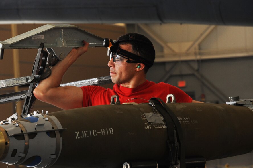 Senior Airman Abdiel Ruiz-Borres, 96th Aircraft Maintenance Unit Crew Cobra 1 member, secures a GBU-38 for transport during the second quarter weapons load competition at Barksdale Air Force Base, La., July 8, 2016. A GBU-38 is a 500-lb guided air-to-surface weapon with a range up to 15 miles and is accurate in any weather condition. (U.S. Air Force photo/Airman Alexis C. Frost)