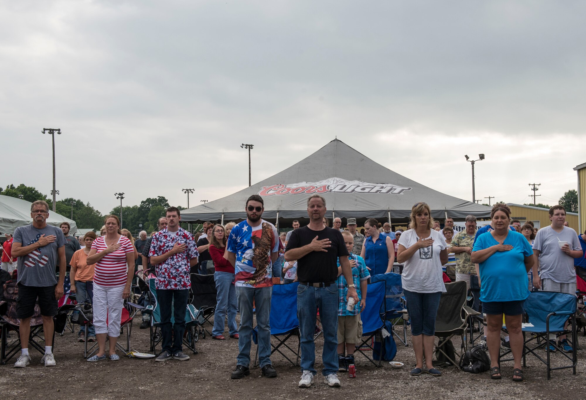 Despite the rainy weekend, thousands made it to the Old Fashioned 4th of July Celebration at Scheve Park, which featured carnival rides, live bands, food and craft booths, softball and kickball tournaments, games, raffles, poker and a fireworks show, Mascoutah, Ill., July 4, 2016.  Col. Terrence Adams, 375th Communications Group commander, spoke to spectators during the event in remembrance of Independence Day.  Following Adams, the U.S. Air Force Band of Mid-America’s Roots in Blue played favorite classics and current hits until fireworks lit the night sky. (U.S. Air Force photo by Staff Sgt. Jodi Martinez/Released)