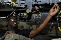 Staff Sgt. Charlie Mathis, 20th Aircraft Maintenance Unit Crew Viper 7 crew member, prepares the conventional rotary launcher for loading at Barksdale Air Force Base, La., July 8, 2016. One crew from the 20th AMU and one crew from the 96th AMU compete for being deemed “Top Weapons Load Crew for the Quarter.” (U.S. Air Force photo/Airman 1st Class Stuart Bright)