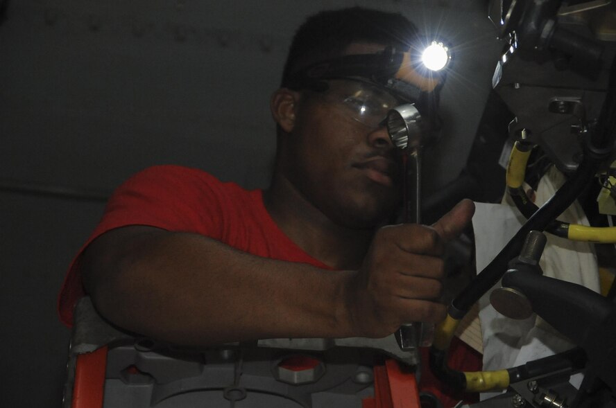 Airman 1st Class Jatniel Pinell, 96th Aircraft Maintenance Unit Crew Cobra 1 Crew Member, prepares on the conventional rotary launcher of a B-52 Stratofortress for loading at Barksdale Air Force Base, La., July 8, 2016. The competition is based on a point system. It is scored on dress and appearance, B-52 weapons system test, weapons load box and equipment inspection by quality assurance and weapons loading technical operation members. (U.S. Air Force photo/Airman 1st Class Stuart Bright)