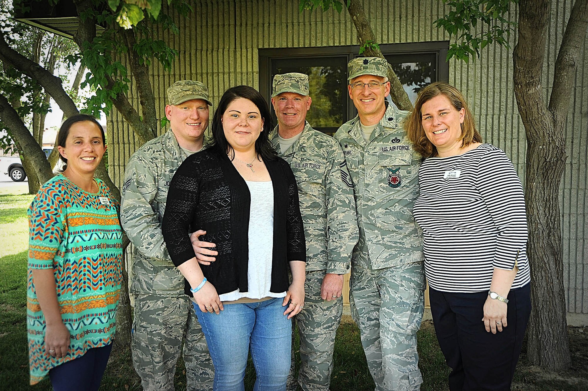 “Sometimes people think that when you experience loss, that you want to be left alone in your grief, but the opposite is true.  You want your family to be there to comfort you and help you through this incredibly hard time.  Our squadron was our family, and they were there for us,” said Cindy Johnson (third from left with her husband Senior Airman Nicholas Johnson).  Those Air Force family members included Angie Chen, a squadron key spouse, Master Sgt. Daniel Libby, first sergeant, and Lt. Col. Scott Bryant and his wife, Amy.  (Photo by Karen Petitt)
