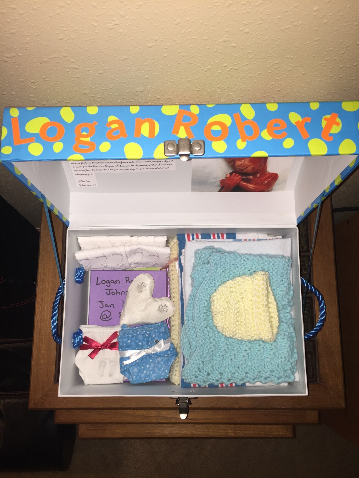 Emphasizing that children lost in pregnancies are not forgotten, the Johnsons made a keepsake box for Logan and fill it with items that he might have liked, such as toy dinosaurs.  The Johnsons have become involved with the Pregnancy and Infant Loss Support Group and hope to create an awareness event on base in the near future. (courtesy photo)