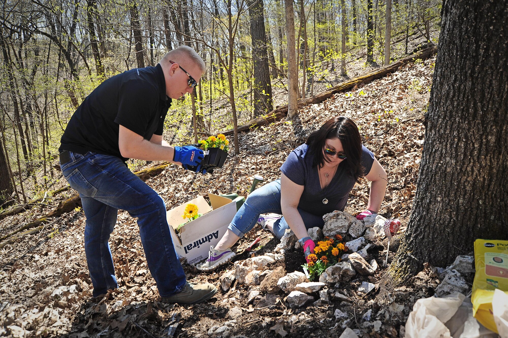 Senior Airman Nicholas Johnson and his wife, Cindy, create a memorial at a science nature preserve in Missouri for the child they lost on Cindy’s birthday--Jan. 12.  Nick, who is assigned to the 375th Civil Engineer Squadron, was deployed when Cindy became hospitalized but thanks to herculean efforts from their military family, he made it back in time to be with his wife when Logan Robert was born at five months into her pregnancy.  (Photo by Karen Petitt)