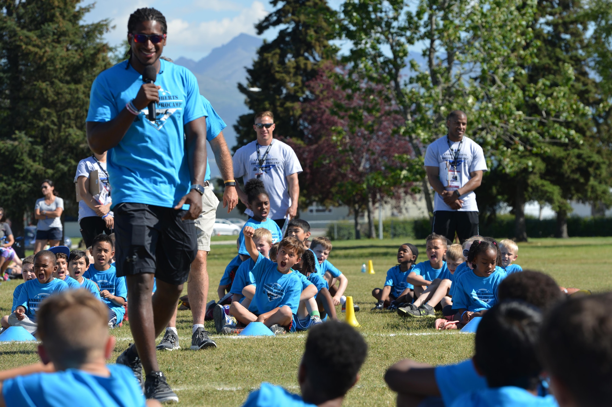 Andre Roberts, a wide receiver with the Detroit Lions, gives words of encouragement to Military ProCamp attendees at Joint Base Elmendorf-Richardson, Alaska, June 12, 2016. Robert’s mother and father are both retired from the Army, and he proudly claims the title of military brat. (U.S. Air Force photo by Airman 1st Class Javier Alvarez)