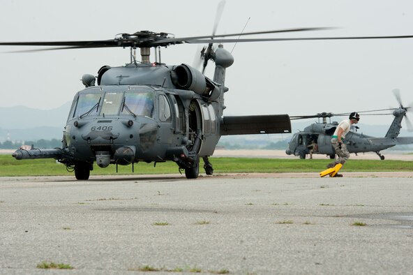 Senior Airman Paul Roberts, 33rd Helicopter Maintenance Unit crew chief, pulls chalks from an HH-60G Pave Hawk assigned to the 33rd Rescue Squadron prior to a flight during Exercise Pacific Thunder 16-2 at Osan Air Base, Republic of Korea, July 12, 2016. The 33rd RQS is participating in Pacific Thunder, the largest Pacific combined joint exercise in which U.S. and ROK forces train and test combat search and rescue skills. (U.S. Air force photo by Staff Sgt. Jonathan Steffen/Released) 
