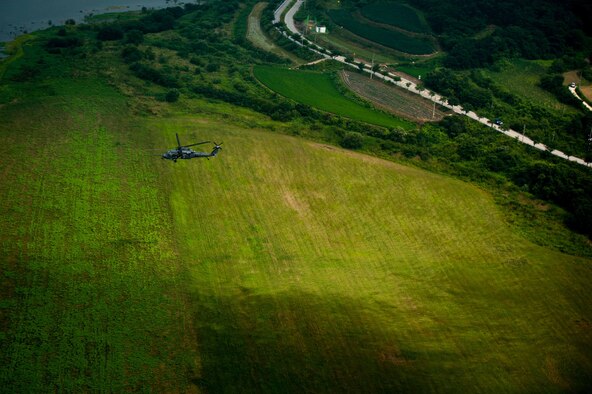 An HH-60G Pave Hawk assigned to 33rd Rescue Squadron flies over Republic of Korea countryside during Exercise Pacific Thunder 16-2, July 13, 2016. The 33rd RQS comes to Osan AB, ROK, for Pacific Thunder to train their combat search and rescue capabilities. (U.S. Air Force photo by Staff Sgt. Jonathan Steffen/Released) 