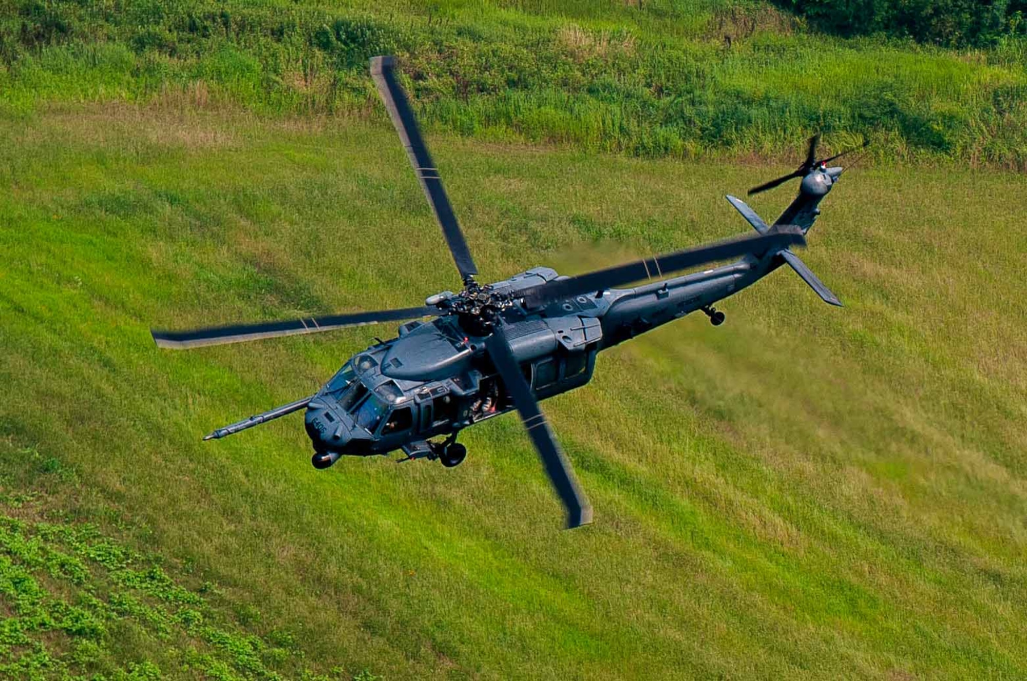 An HH-60G Pave Hawk assigned to 33rd Rescue Squadron flies over Republic of Korea air space for Exercise Pacific Thunder 16-2, July 13, 2016. The 33rd RQS comes to Osan AB, ROK, for Pacific Thunder to train their combat search and rescue capabilities. (U.S. Air Force photo by Staff Sgt. Jonathan Steffen/Released) 