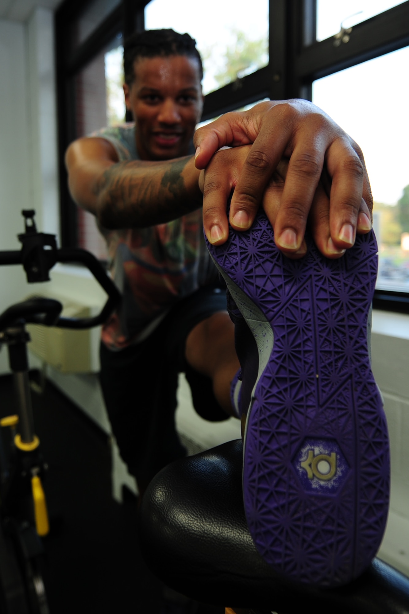 David Graham, spin class participant, stretches after a morning spin class at Anderson Field House at Fort Eustis, Va., July 11, 2016. Spinning is used to relieve stress and improve personal fitness goals.(U.S. Air Force photo by Staff Sgt. Natasha Stannard)