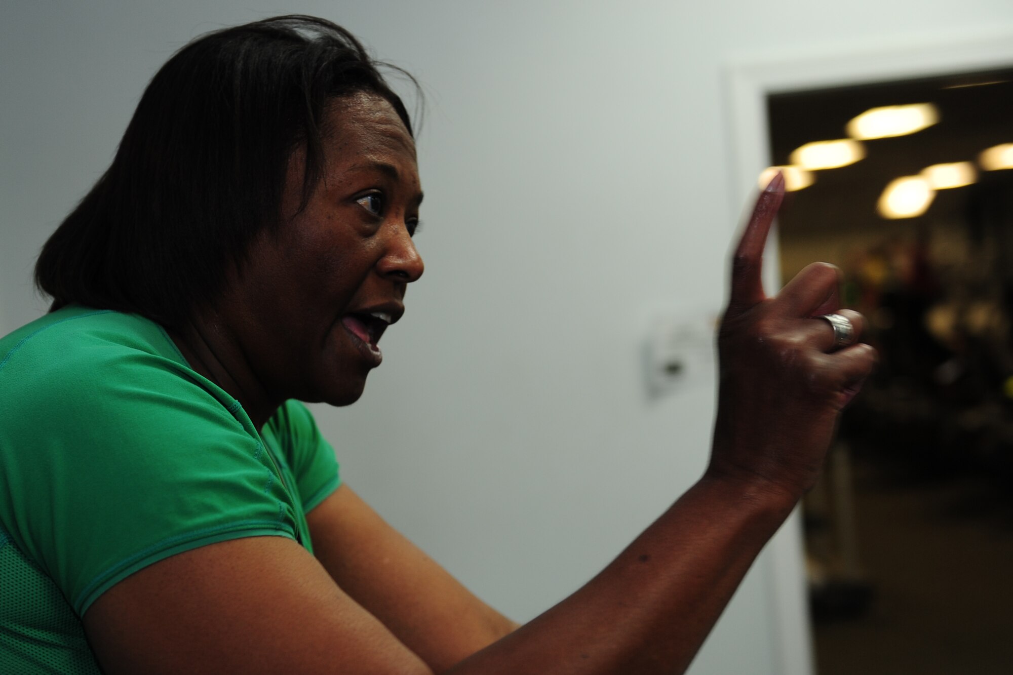 Darlean Basuedayva, spin class instructor, guides spin attendees through her class at Anderson Field House on Fort Eustis, Va., July 11, 2016. Basuedayva, a retired U.S. Air Force major, teaches the class as a way to promote fitness and healthy lifestyle choices to her fellow military and civilian partners.  (U.S. Air Force photo by Staff Sgt. Natasha Stannard)