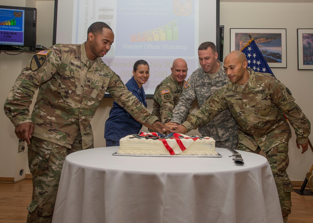 U.S. Army Lt. Gen. H.R. McMaster, Training and Doctrine Commands Army Capabilities Integration Center director, participates in a cake cutting ceremony with warrant officers during Warrant Officers Week at Fort Eustis, Va., July 7, 2016. The U.S. Army warrant officer corps was created July 9, 1918 and recently celebrated its 98th birthday. (U.S. Air Force photo by Airman 1st Class Derek Seifert)