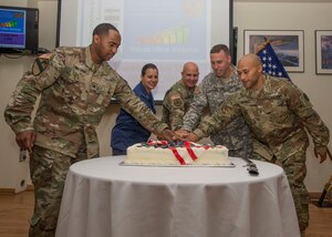 U.S. Army Lt. Gen. H.R. McMaster, Training and Doctrine Commands Army Capabilities Integration Center director, participates in a cake cutting ceremony with warrant officers during Warrant Officers Week at Fort Eustis, Va., July 7, 2016. The U.S. Army warrant officer corps was created July 9, 1918 and recently celebrated its 98th birthday. (U.S. Air Force photo by Airman 1st Class Derek Seifert)