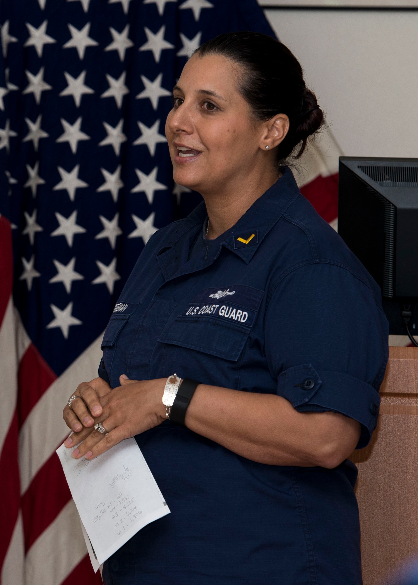 U.S. Coast Guard Chief Warrant Officer 3 Laura Freeman, Chief Warrant Officer Association Norfolk district president, briefs a crowd of warrant officers and candidates during Warrant Officer Week at Fort Eustis, Va., July 7, 2016. The Coast Guard has about 1,800 active duty warrant officers who perform duties ranging from technical jobs to acting commander for units. (U.S. Air Force photo by Airman 1st Class Derek Seifert)