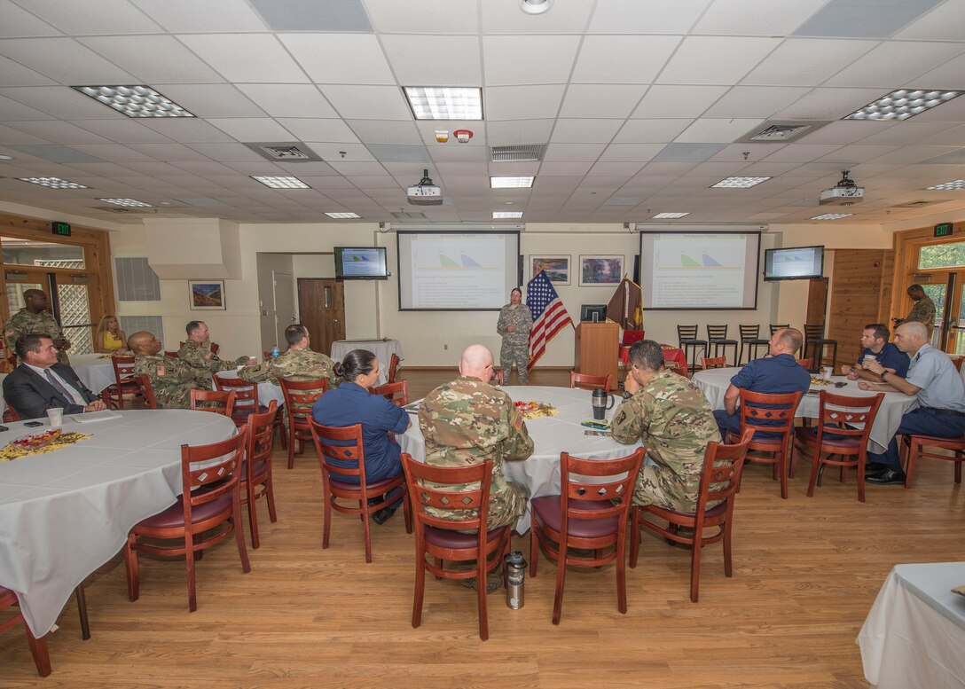 U.S. Army Chief Warrant Officer 3 Reba Wallner, Human Resources Center junior signal warrant assigned officer, speaks during Warrant Officer Week at Fort Eustis, Va., July 7, 2016. Warrant Officer Week gives warrant officers of all branches a way to network, voice their concerns and learn updated information regarding the warrant officer ranks. (U.S. Air Force photo by Airman 1st Class Derek Seifert)