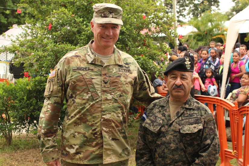 Comayagua, Honduras - U.S. Army Col. Brian Hughes, commander of Joint Task Force-Bravo (left), and Honduran Army Col. Julio Cesar Urquia (right), Director of the Experimental Center of Agricultural Development and Ecological Conservation (CEDACE), pose for a photo during a Military Partnership Engagement between JTF-Bravo and CEDACE in San Sebastian, Comayagua, Honduras, July 9, 2016. MPEs provide an opportunity to engage with the community while supporting the Honduran military efforts in providing care for the local population. (U.S. Army photo by Maria Pinel)