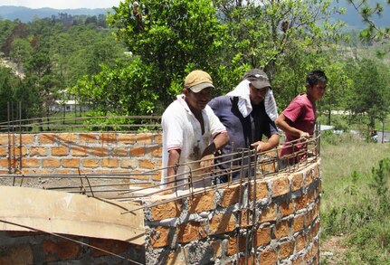 Honduran construction workers take a rest from building a new water well in Comayagua, Honduras, June 14, 2016, where members of Joint Task Force-Bravo’s Medical Element Preventive Medicine team visited to test the water. The MEDEL team provides the community with water purification testing and education on different ways of maintaining a clean water supply in cooperation with the Honduran Ministry of Health of Comayagua. (U.S. Army photo by 1Lt Jenniffer Rodriguez)