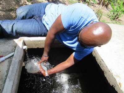 U.S. Army Sgt 1st Class Brian McNeil, Joint Task Force-Bravo Medical Element Preventive Medicine Specialist from Columbia, Missouri, collects a water sample from a local well in Comayagua, Honduras June 14, 2016. McNeil highlighted the education the MEDEL team provides to the community on water purification procedures and different ways of maintaining a clean water supply by maintaining chlorine residual and minimizing sanitation issues such as trash. (U.S. Army photo by 1Lt Jenniffer Rodriguez)