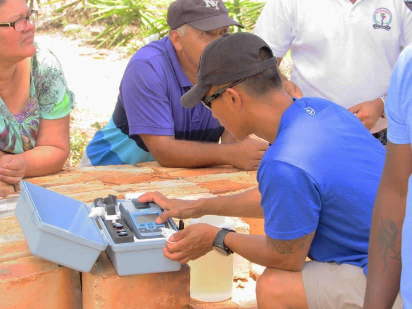 U.S. Army Sgt. Jason Nisperos, Preventive Medicine Specialist, from Springfield, Missouri, tests collected water samples in Comayagua, Honduras June 14, 2016. According to Nisperos, each water sample received is tested for temperature and pH, while other water samples are tested for chlorine residual as well. The team applies skills and knowledge they have learned about Preventive Medicine in the army and in turn help pass those skills to the local nationals - skills such as problem solving if bacteria is found in the water and if there are issues from the containers through the pipelines. (U.S. Army photo by 1Lt Jenniffer Rodriguez) 