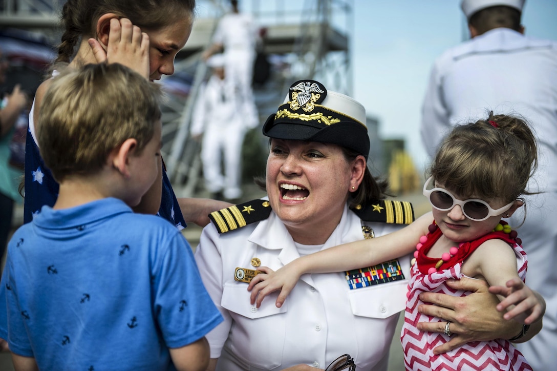 Navy Cmdr. Alysa L. Ambrose Mansfield, commanding officer of the USS Gravely, greets her family during a homecoming celebration at Naval Station Norfolk, Va., July 13, 2016. The Gravely arrived after an eight-month deployment to support maritime security operations and theater security cooperation efforts in the U.S. 5th and 6th fleet areas of responsibility. Navy photo by Petty Officer 2nd Class Justin Wolpert